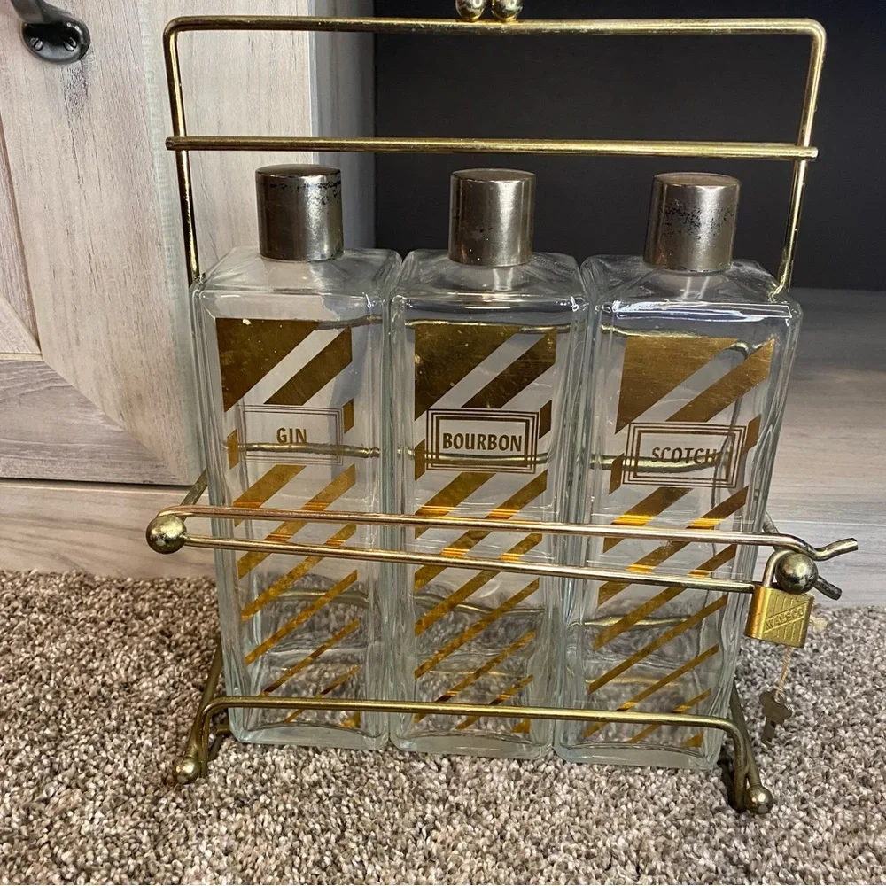 Vintage Decanter with Caddy, three bottle tantalus w Scotch, Bourbon Gin Labels